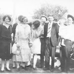 J. R. Shivers family gathering, circa 1927. "Pa-pa" J. R. Shivers holding granddaughter with Claude and Cloyce standing next to him. Courtesy of Shivers family