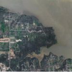 Bob Jones' land included 1000+ acres, much of it in the Denton Creek bottomlands. This aerial view shows much of the Jones homestead under Lake Grapevine. Courtesy City of Southlake