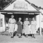 Boards Store was a gathering place located on Continental Boulevard at Brumlow Avenue. Smiling in this photo, l-r, are Beulah Board, Azzie Hardin, Nannie Webb, and Eula Blevins, familiar names of Old Union community farming families, circa 1940s. Court
