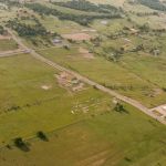 White's Chapel UMC is visible in this aerial photo of the intersection of FM 1709 at White Chapel Blvd. The circa 1970s image shows the church in a grove of trees at the top of the photo. Courtesy WCUMC
